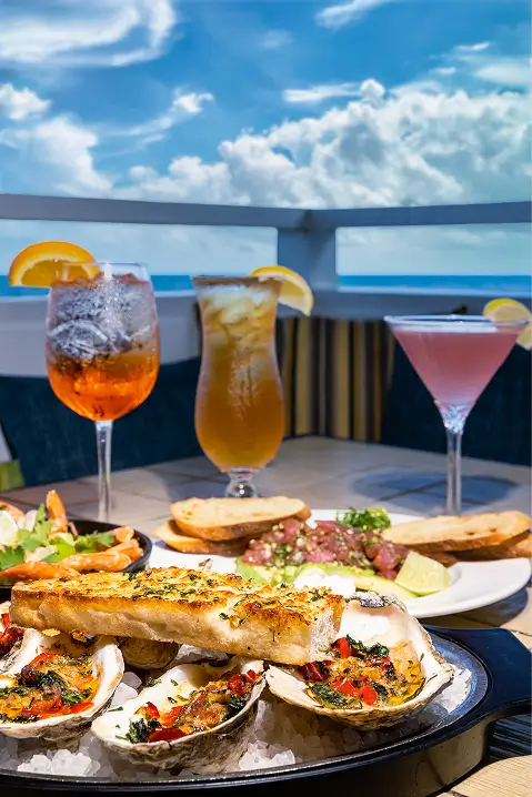 Cocktails and seafood dishes with ocean views at Sea Watch on the Ocean