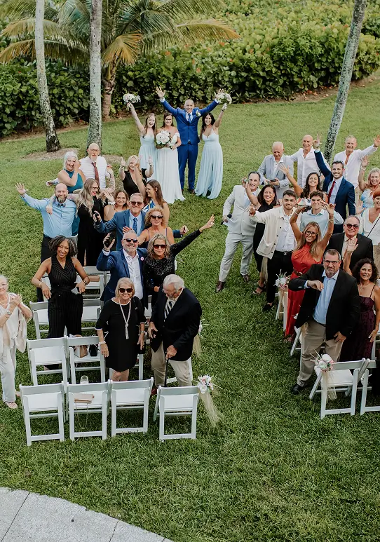 Wedding guests celebrating after a ceremony at Sea Watch on the Ocean