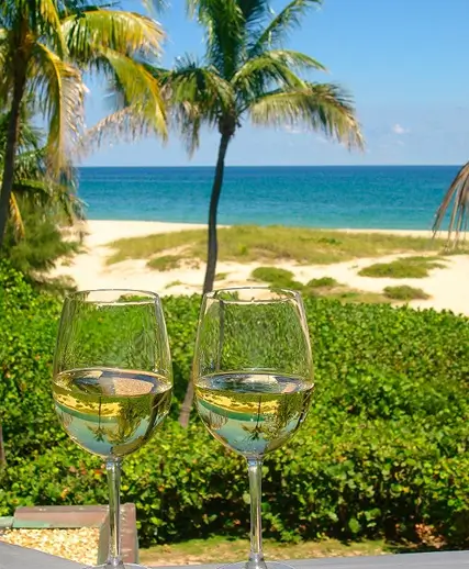 White wine glasses overlooking the ocean at Sea Watch on the Ocean